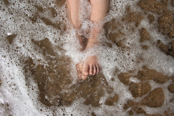 Rolling waves on your feet on the beach.