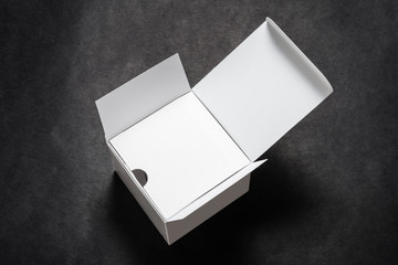 White cosmetic box, package on black background
