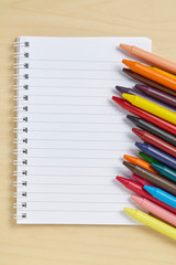 Colorful crayon on wooden table