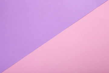 Fototapeta premium Pink and purple paper as background. Two colored pastel paper texture, top view with place for text