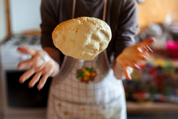 Mother preparing bread and pasta in traditional way. Mother's day concept