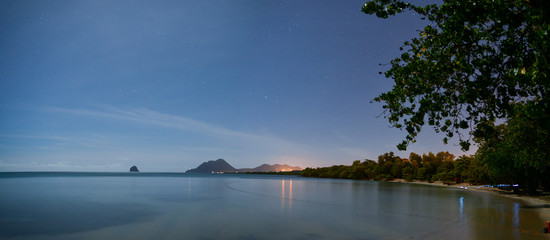 night panorama  facing an  Exotic Antilles beach with palm tree on the Martinique Tropical beach 