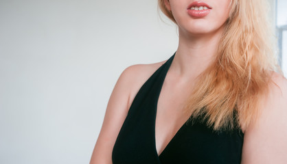 Fototapeta premium Beautiful female neck and lips of delicate pink color
