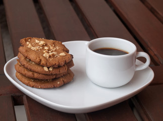 cookies and coffee on the wooden desk