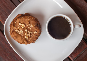 cookies and coffee on the wooden desk
