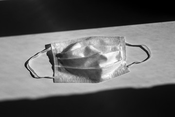 Face mask protection against pollution, virus, flu and coronavirus on gray background.