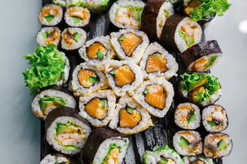Different rolls background. Traditional sushi. Delicious japanese food.
