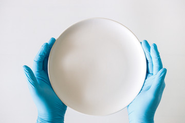 hand in medical glove, blue color, concept of protection against viruses