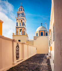 Perfect morning view of Catholic Cathedral Church of Saint John The Baptistm in Fira village,...