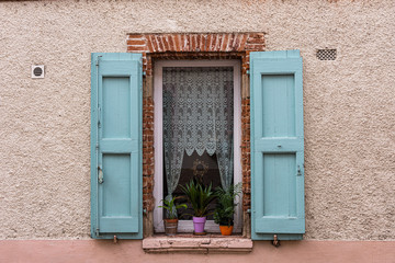 Plakat Saint Sulpice, France - August 2013: quaint window in terraced house