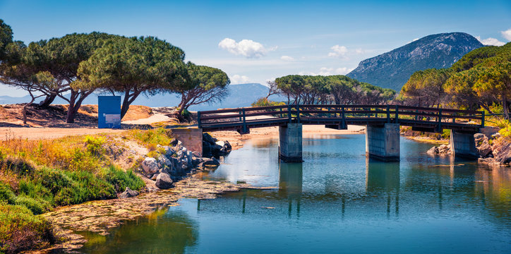 Attractive morning view of Osala Beach. Sunny summer scene of Sardinia island, Italy, Europe. Beautiful seascape of Mediterranean sea. Traveling concept background.