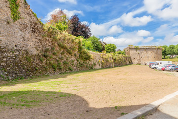 Fototapeta na wymiar Dinan, France. Car parking under the medieval walls