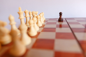 chess on a chessboard on a white background

