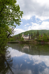 Fototapeta na wymiar Lake Hamori with the Lilafured palace and Bukk mountains in the background