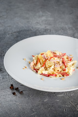 Salad with pine nuts, cabbage, bacon, pepper