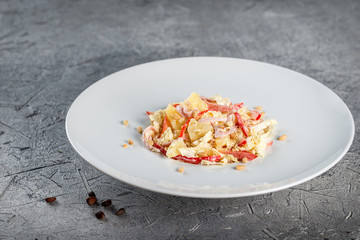 Salad with pine nuts, cabbage, bacon, pepper