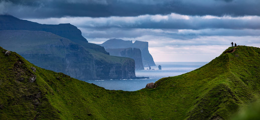 Popular tourist attraction - Risin og Kellingin cliffs, Kallur Lighthouse location, Kalsoy island. Panoramic morning view of Eysturoy island, Atlantic ocean, Faroe Islands, Denmark, Europe. © Andrew Mayovskyy