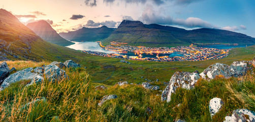 Amazing summer cityscape of Klaksvik town. Incredible evening scene of Bordoy island, Faroe,...