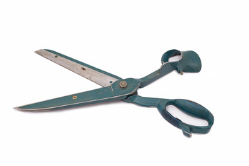 Large old tailor scissors with scratches isolated on white background