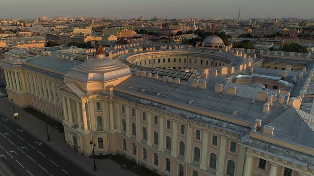Aerial Academy of Arts museum St. Petersburg historical unique building courtyard well round. Old classic style architecture. Beautiful central cityscape. Russia. Sunset warm light. Flight forward