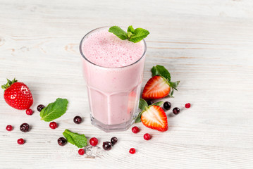 Strawberry milkshake in a glass on a leg