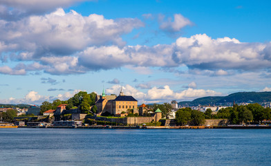 Fototapeta na wymiar Oslo, Norway - Panoramic view of medieval Akershus Fortress - Akershus Festning - historic royal residence at Oslofjord sea waterfront in Pipervika borough of Sentrum city center