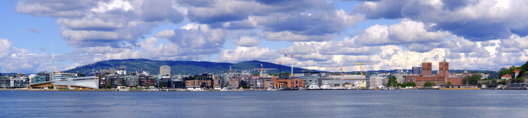 Oslo, Norway - Panoramic view of Oslo waterfront with City Hall, Aker Brygge and Tjuvholmen borough...