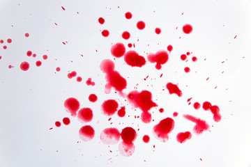 Fototapeta na wymiar Many drops of blood on a white background 