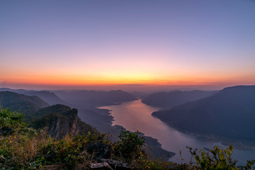 Fototapeta na wymiar Landscape view of beautiful sunrise on big river and mountain view point