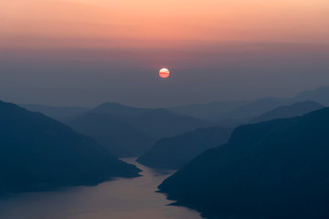 Landscape view of beautiful sunrise on big river and mountain view point
