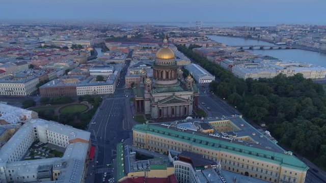 Flight above historical streets St. Petersburg downtown evening cityscape. St. Isaac's Cathedral famous orthodox central church. Neva Fontanka river. Deserted no cars. River port horizon. Yards wells