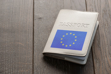 Close up on European Union passport on wooden background