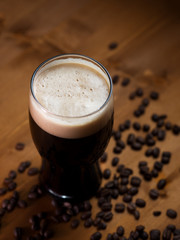 stout or porter with coffee on a wooden pub table