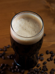 stout or porter with coffee on a wooden pub table