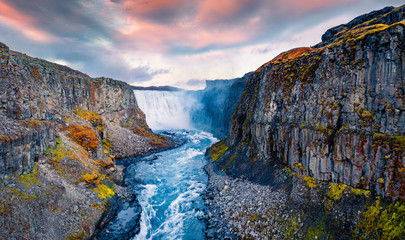 View from down of canyon of most powerful waterfall in Europe - Dettifoss. Splendid summer sunrise in Jokulsargljufur National Park, Iceland. View from flying drone.