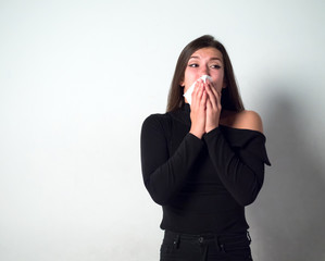 young woman covering mouth in allergy reason