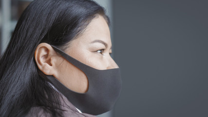 Asian Businesswoman In Black Protective Mask