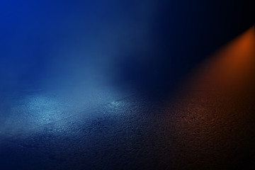 Empty background scene. Rays of neon light in the dark, neon figures, smoke. Background of empty stage show. Abstract dark background.
