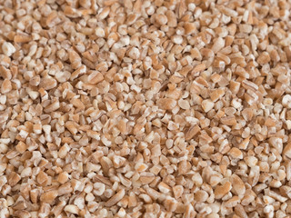 Fine Ground wheat groats pattern texture close up