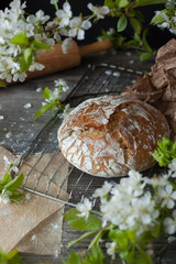 gluten-free homemade bread, healthy and wholesome food, spring cherry flowers or cherries on the table. comfortable home environment