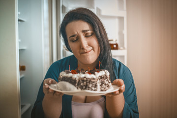 Plus Size Woman Woman Admires Chocolate Cake