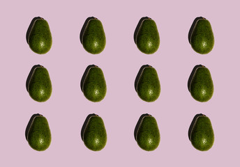 Avocado pattern isolated on purple background. Fresh. Vegetables. Food photo. 
