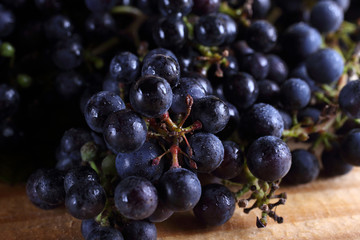 Black wine grape on table