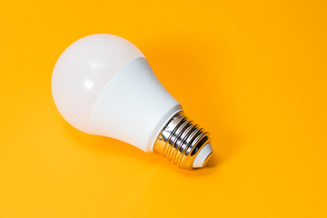 LED, New technology light bulb on yellow background, Energy super saving electric lamp is good for environment