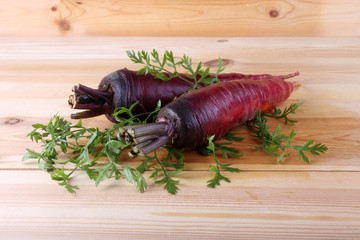 Red carrots on leaves