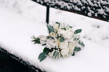 bridal bouquet. Yellow, white flowers with eucalyptus, white ribbon on nature on a background of...