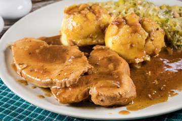 Stewed turkey meat in gravy.