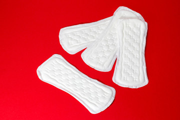 Daily female gasket on red background. copy space.