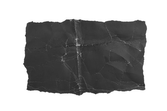 Black crumpled torn paper page. Isolate on a white background. Dusty shabby folds. For design and titles.
