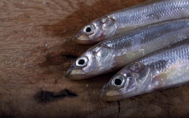Smelt fish on cutting board